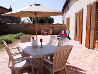 The private terrace with BBQ, sun loungers and table and chairs.